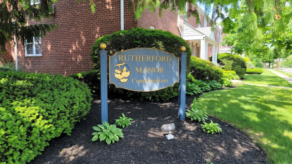 Rutherford Manor Condominium entrance sign at a property under TPM management